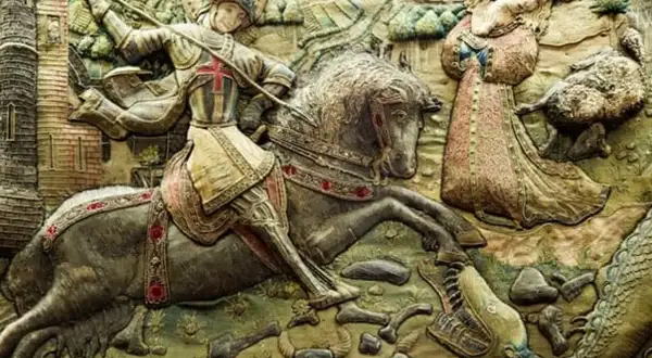 Relieve de San Jorge luchando contra el dragón, con la princesa a salvo. Una escena épica de España.