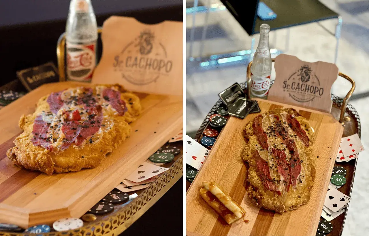 El cachopo Zaragoza, un plato crujiente con jamón y queso, servido con fichas de póker y una botella de refresco.